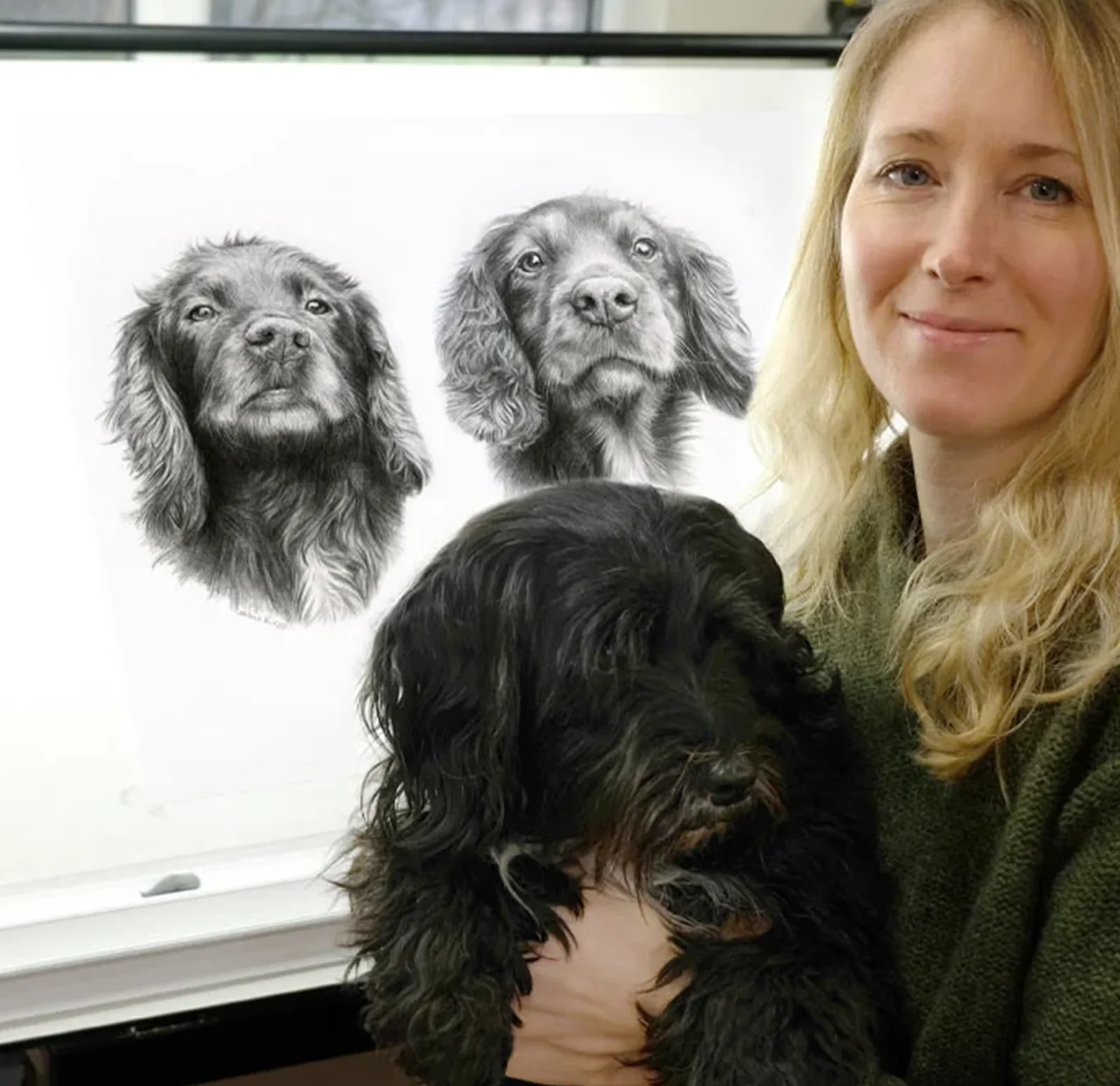 Pet Portraits in Pencil by Melanie Phillips, showing the artist with a dog