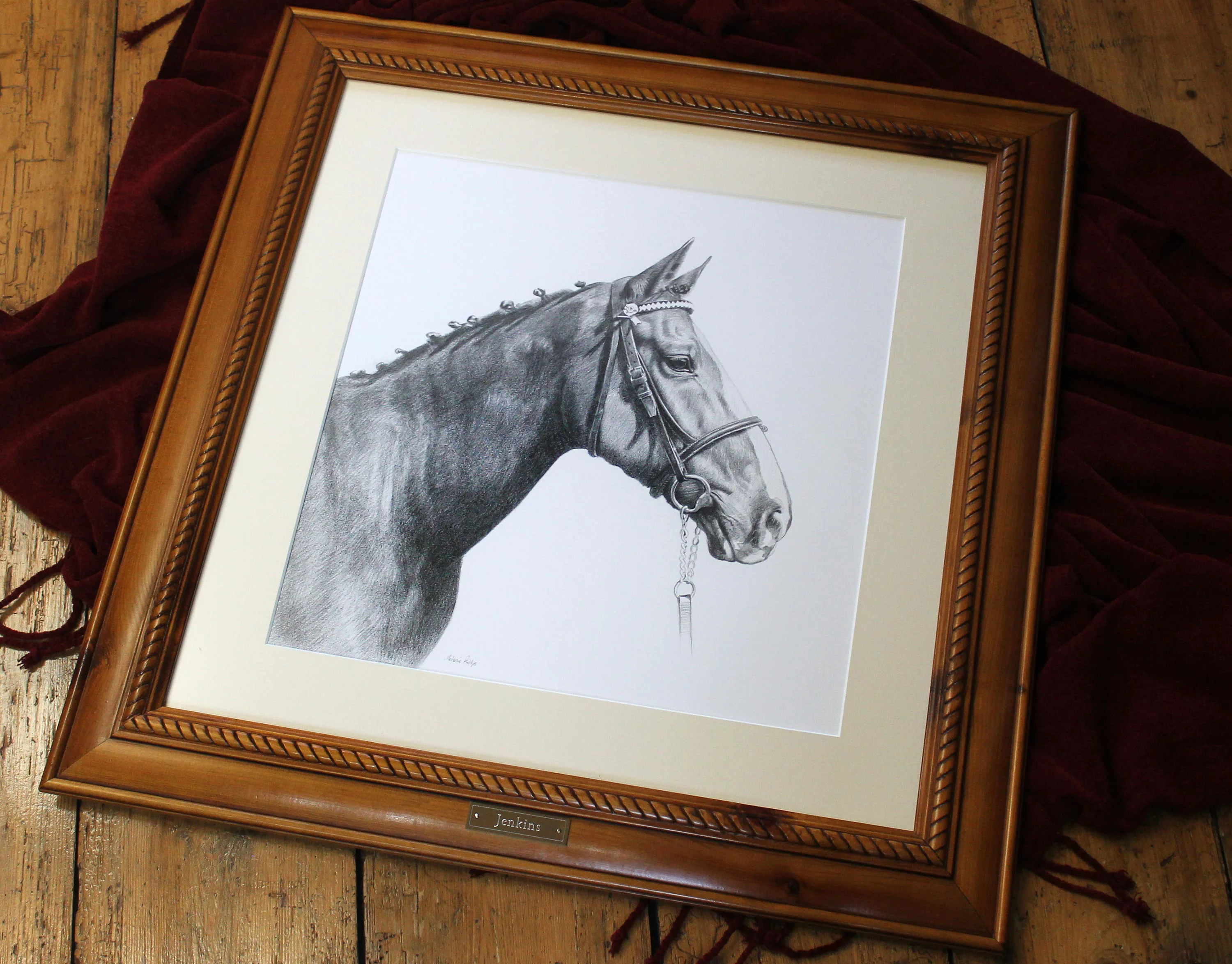 The framed pencil portrait of retired police horse Jenkins, complete with an engraved name plaque.