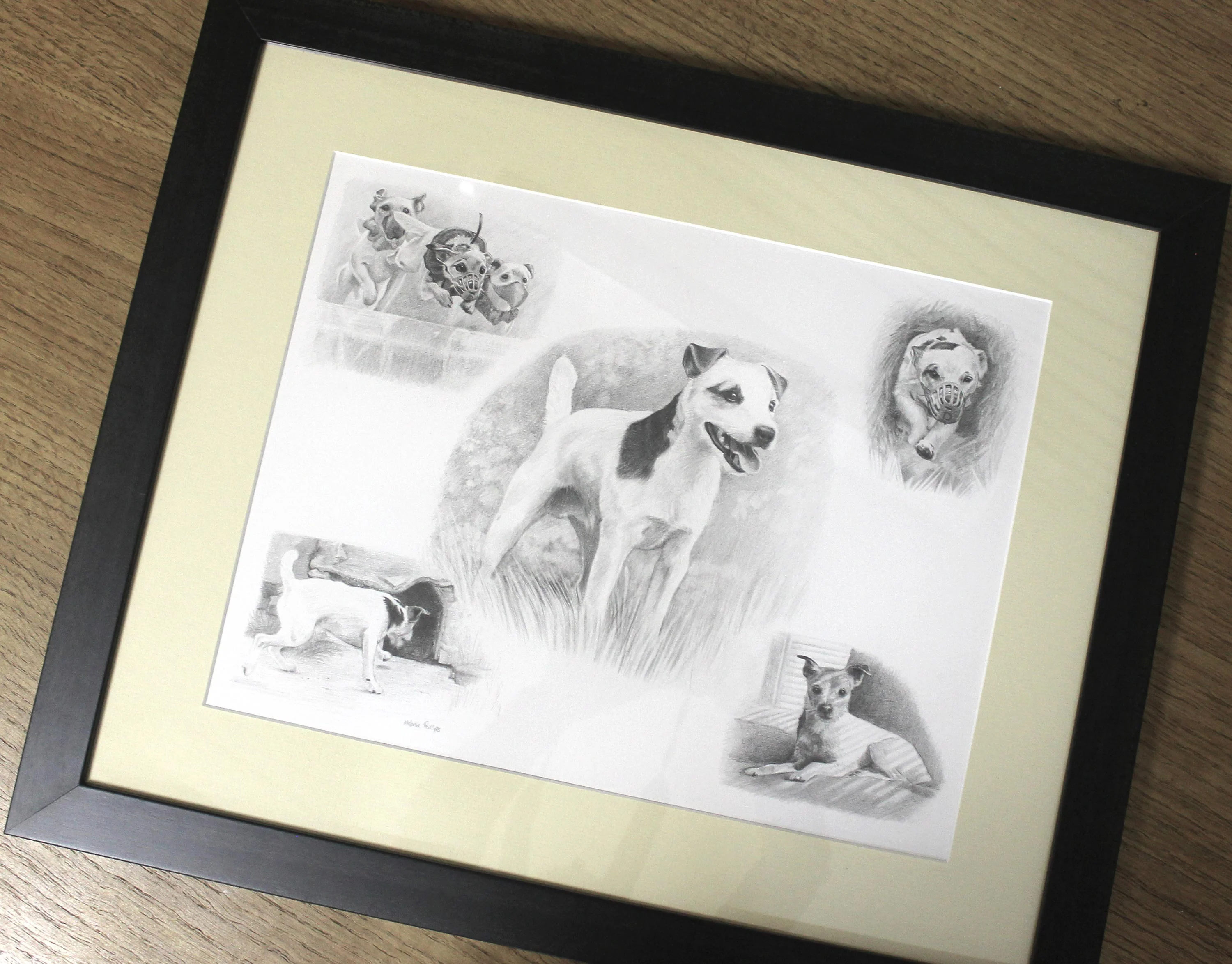 The Jack Russell pencil portrait of Dean displayed on a mini easel.